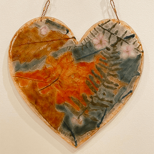 image of glass heart with leaves