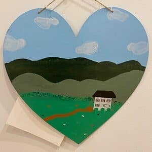 image of heart with house painted on